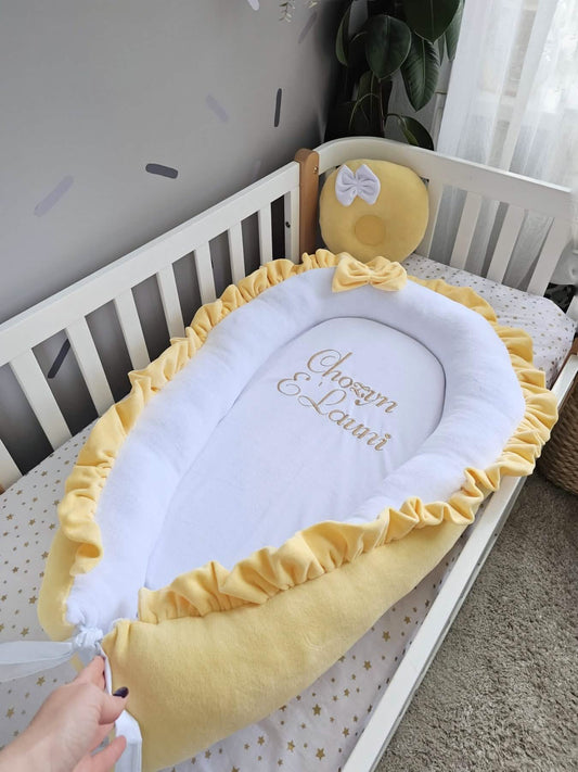 Baby nest with baby name and yellow small pillow. KAR studio