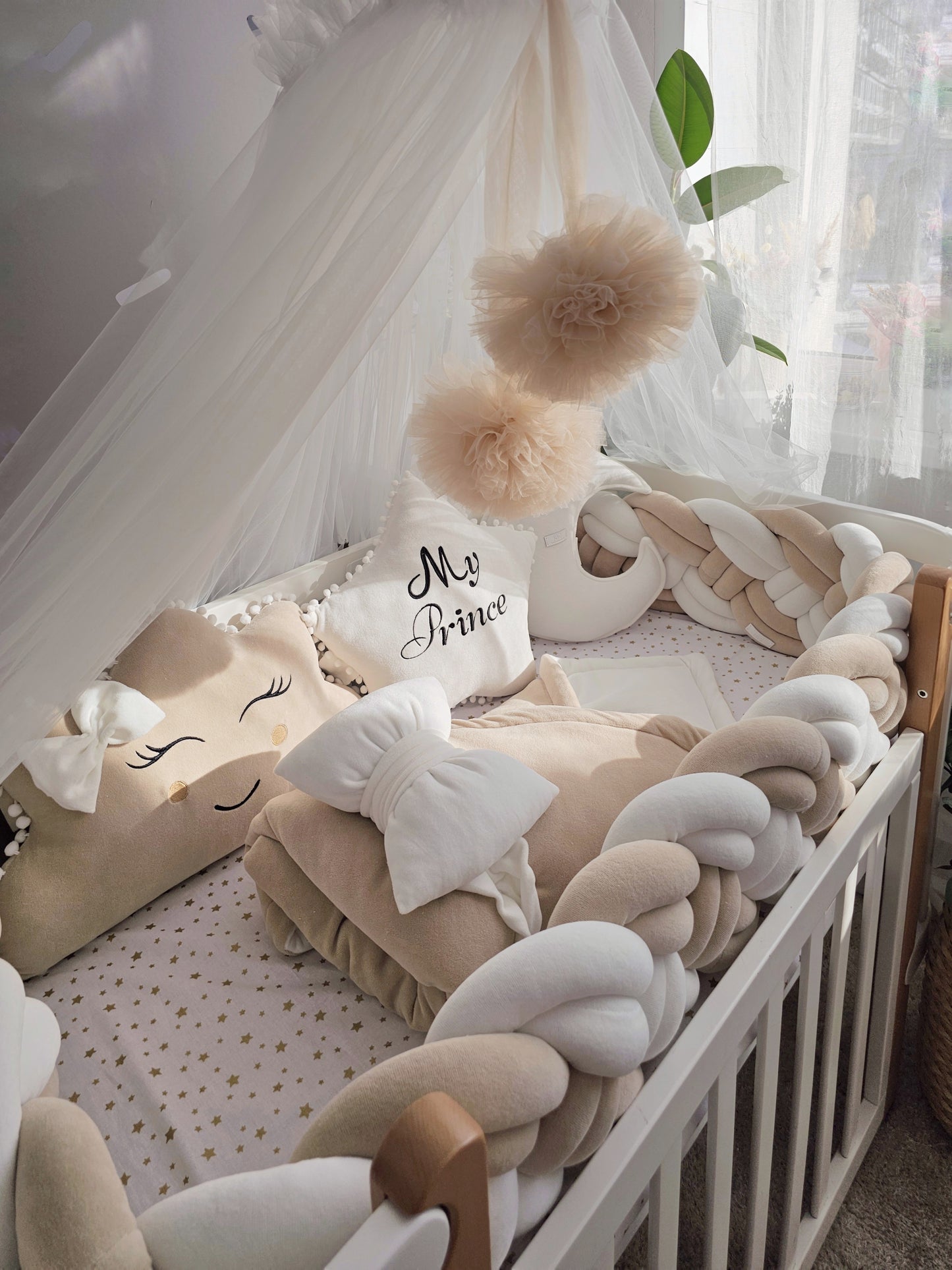 Beige baby crib bedding set with braided crib bumper. Kari studio